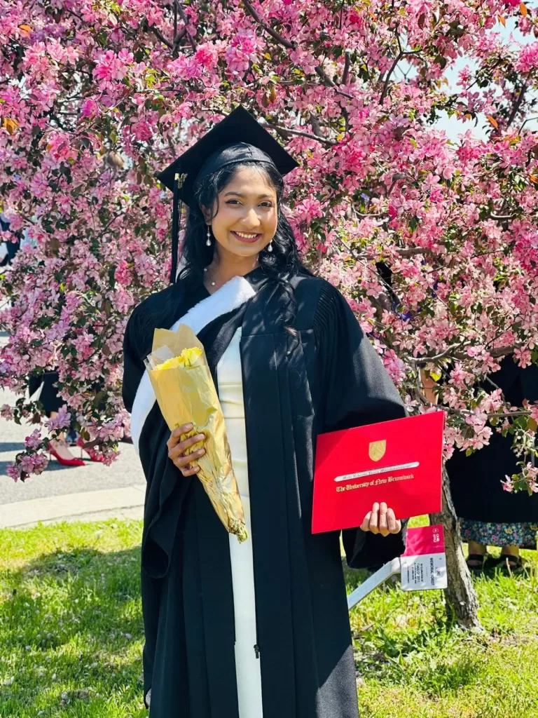 Malki graduating with her Psychology degree in Canada